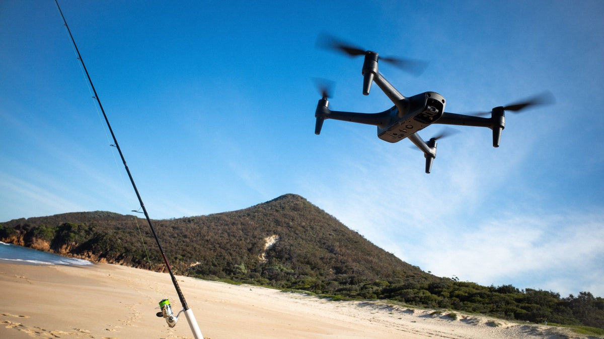Fishing drone flying over an Australian beach, illustrating the cost of a complete fishing drone setup