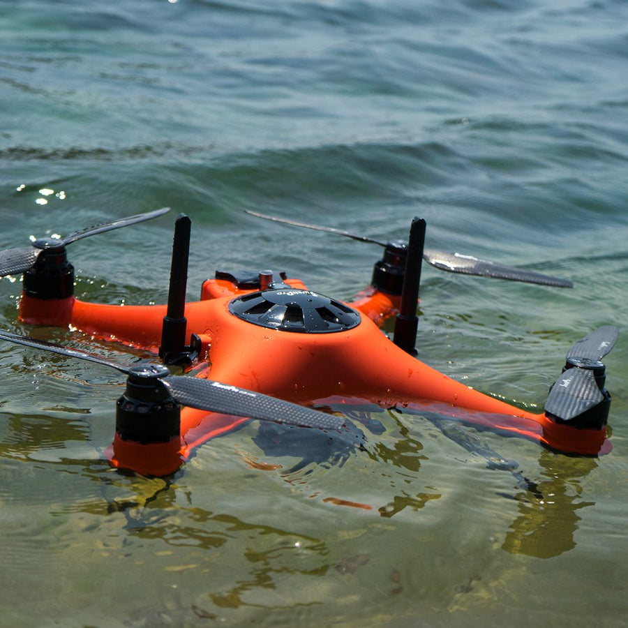 Waterproof SwellPro fishing drone floating on water for waterproof fishing drones guide
